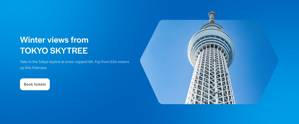 Tokyo Skytree tower under a clear blue sky.